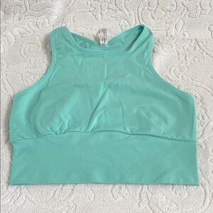 FP MOVEMENT tank 
NWOT 
Green/blue colour 
Size m/l
Opening in back​​​​